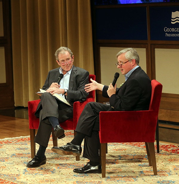 Jon Meacham discusses George H.W. Bush with President George W. Bush (Grant Miller / George W. Bush Presidential Center)