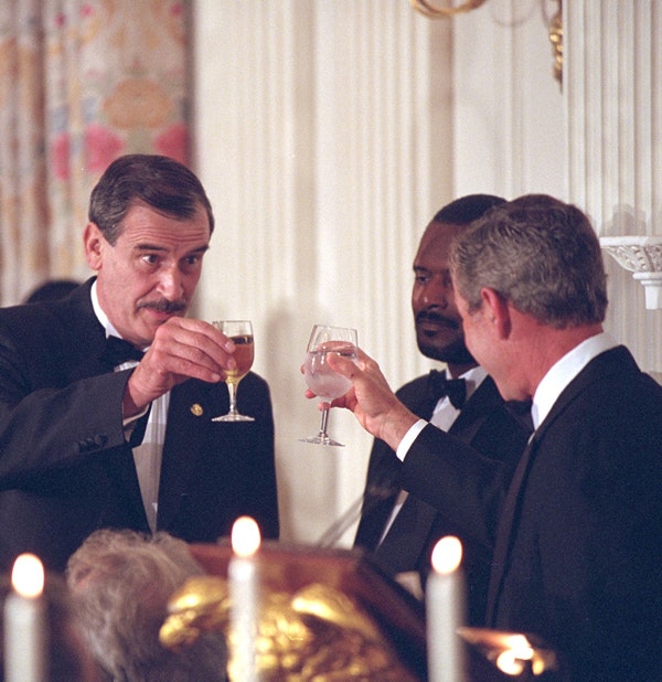 Presidents Fox and Bush toast each other at the State Dinner Wednesday evening at the White House. (Eric Draper / George W. Bush Library and Museum/NARA)
