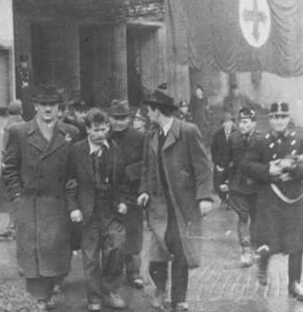 Members of the fascist Arrow Cross Party arrest Jews. Budapest, Hungary, October-December 1944. (US Holocaust Memorial Museum)