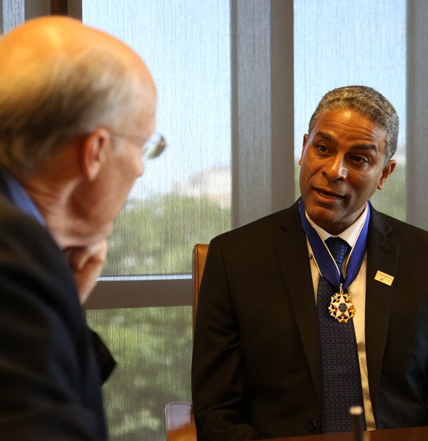 Dr. Oscar Biscet wears his Presidential Medal of Freedom as William McKenzie interviews him at the Bush Center, June 23, 2016. (Andrew Kaufmann / George W. Bush Presidential Center)