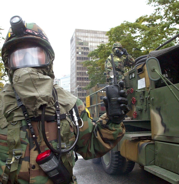 South Korean rescue workers participate in an anti-chemical and anti-biological terror drill on September 15, 2004 in Seoul, South Korea. (Chung Sung-Jun/Getty Images)