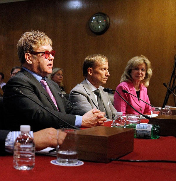 Sir Elton John, Dr. Mark Dybul, and Ambassador Deborah L. Birx, M.D. testify before a U.S. Senate subcommittee hearing on global health programs, May 6, 2015 in Washington, D.C. (Paul Morigi/Getty Images