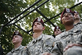 Soldiers Saluting American Flag